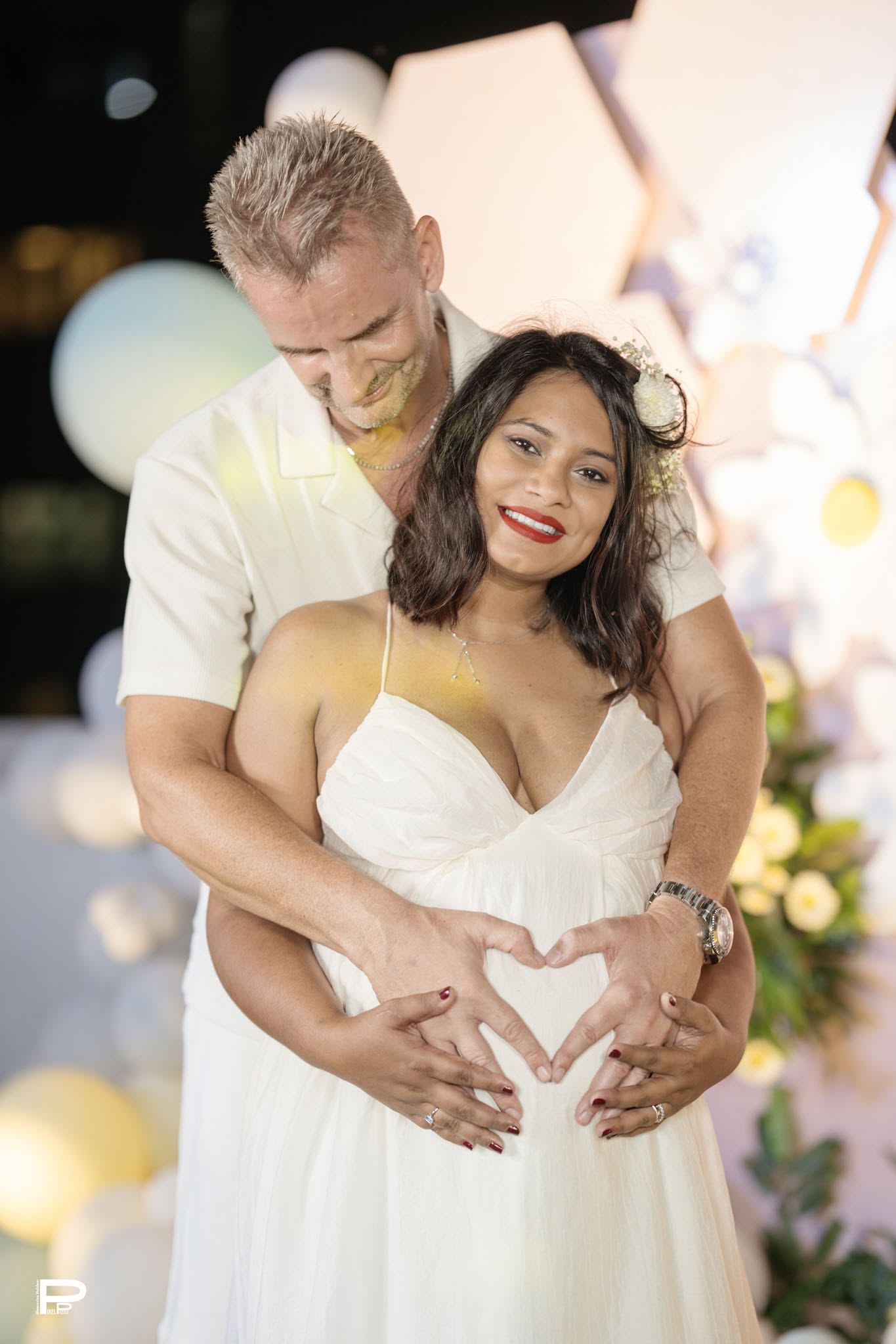 Expecting couple sharing a joyful maternity moment