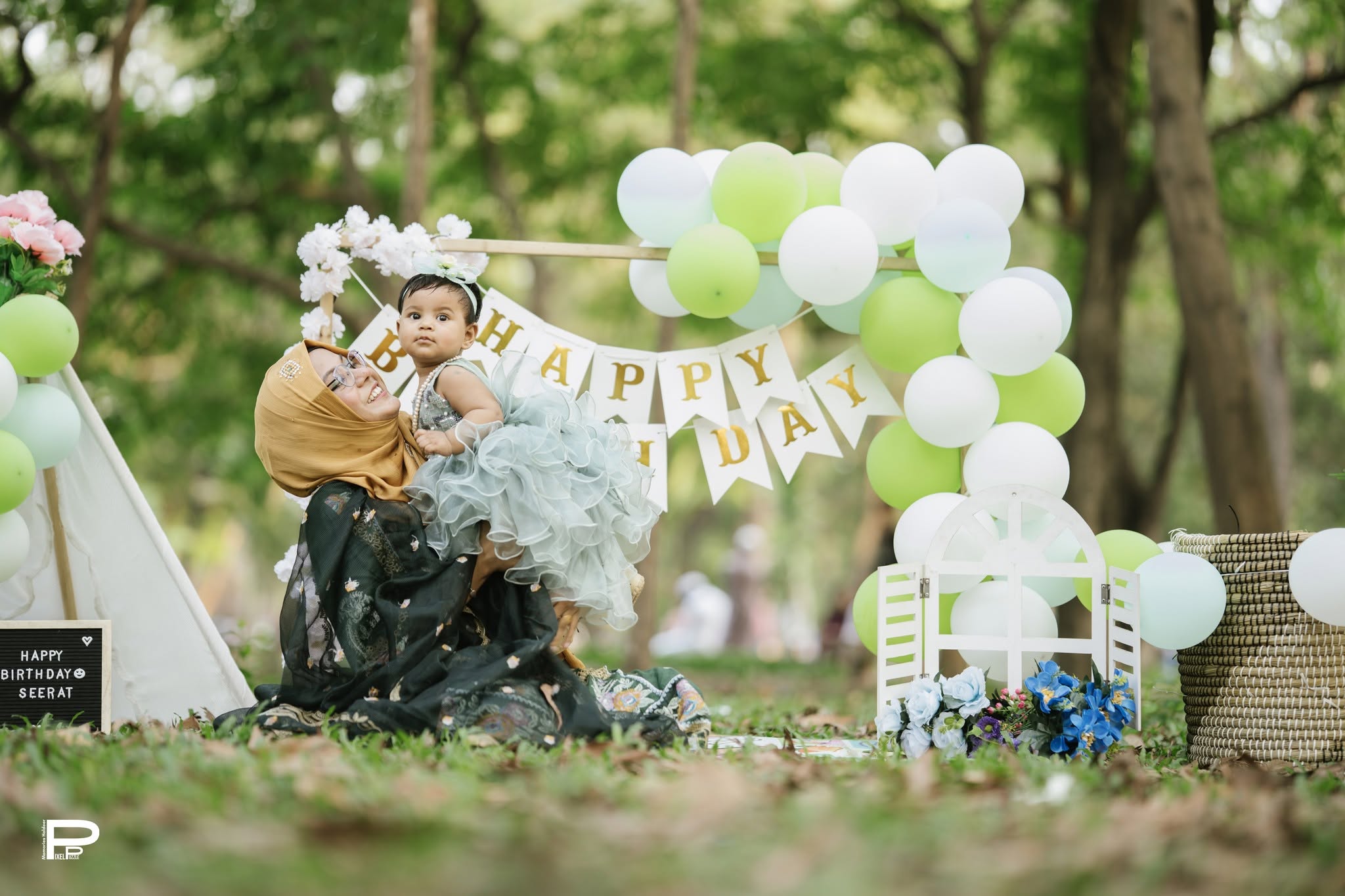 Outdoor first birthday setup with family
